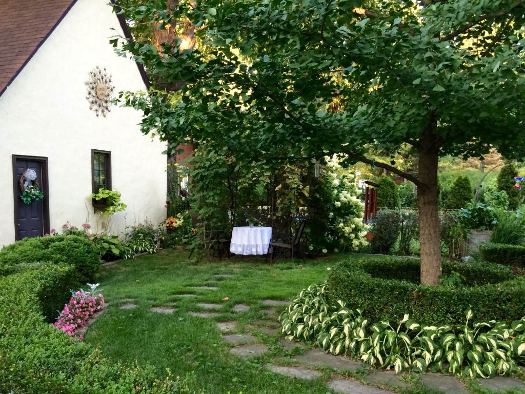 Sheila set a table under the arbor in her lovely garden.